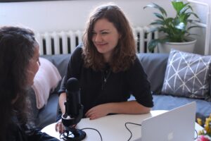 Two women conducting a radio interview